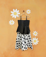 Black polka peplum gown